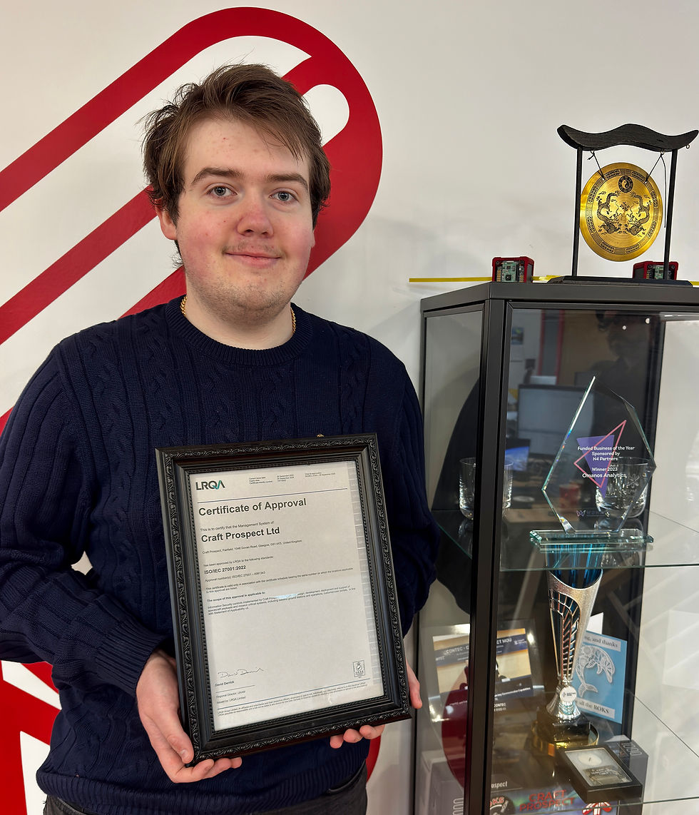 Craft Prospect's Space Security Engineer Scott Nichol holding our ISO 27001 certificate from LRQA.