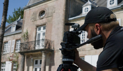 Camera operator capturing footage