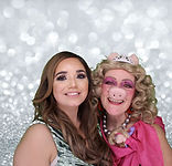 2 women in a photo booth with a silver glitter background