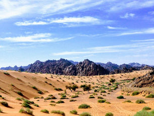 Sand dunes and rocky mountains in the Saudi Arabian desert