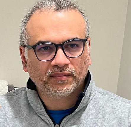 Headshot of a the Principal software architect wearing glasses
