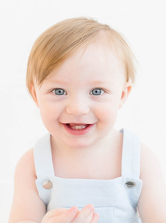 a smiling baby on his birthday