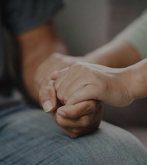 female-friend-or-family-sitting-and-hold-hands-during-cheer-up-to-mental-depress-man-psych