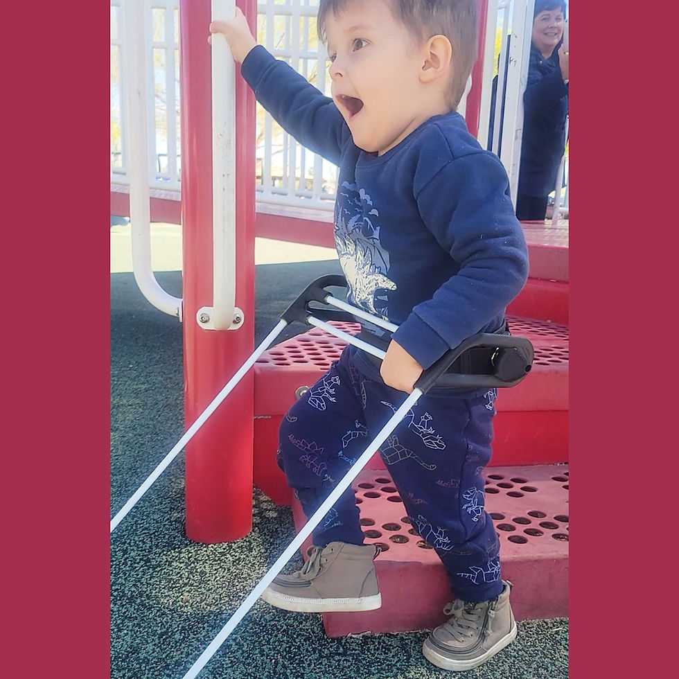 Eye-level view of a child navigating a colorful outdoor jungle gym wearing a Pediatric Belt Cane