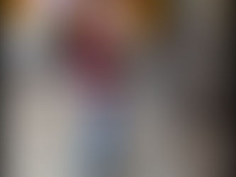 Child in red plaid shirt wears a Belt Cane indoors. Background has colorful blocks. Text: SafeToddles.org. Calm ambiance.