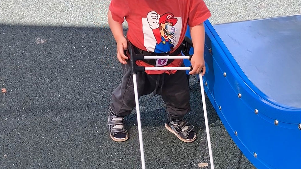 1-year-old with Microphthalmia Colonia & Cataracts wearing a Belt Cane and enjoying slide at the playground