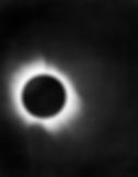Black and white photograph of the total solar eclipse in Brazil on May 29, 1919, with the moon covering the sun and the sun's corona circling the rim of the moon.