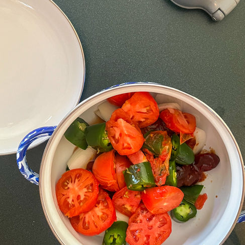 chopped up tomatoes, onions, jalapenos, and chipotle peppers in pot
