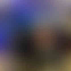 Workers all wearing shark fins while playing Jaws