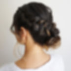 waterfall braid pulled into low bun wedding hair