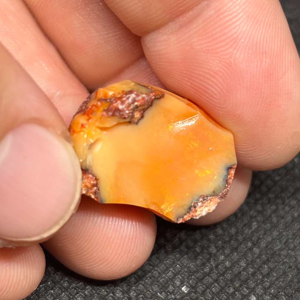 Thumbnail: Mexican Fire Orange Punch Opal Stone Specimen Portraying A Beautiful Light Show