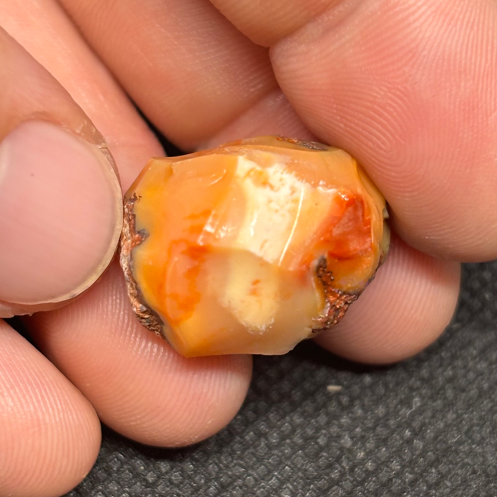 Thumbnail: Mexican Fire Orange Punch Opal Stone Specimen Portraying A Beautiful Light Show