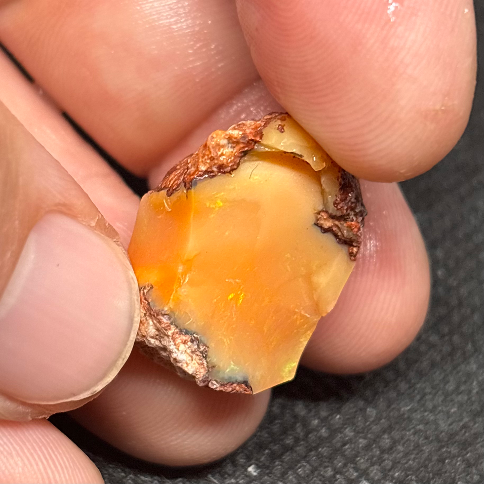 Thumbnail: Mexican Fire Orange Punch Opal Stone Specimen Portraying A Beautiful Light Show
