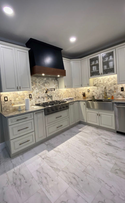 Recessed and under cabinet lighting in a kitchen.