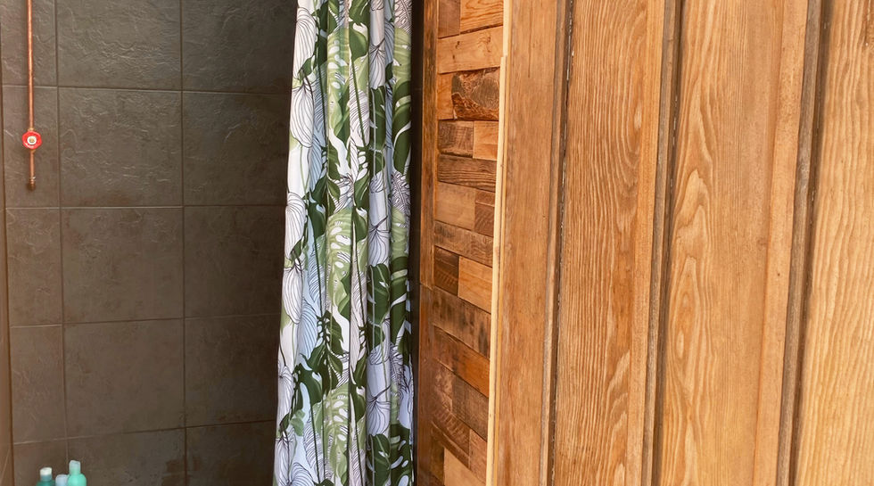 The handmade copper shower with luxury soaps.