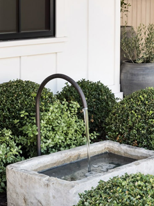 How to Elevate Your Outdoor Space with Sculptural Pottery and Fountains