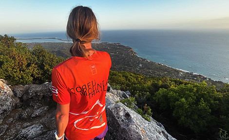 Woman looking over Corfu Island from a view point.