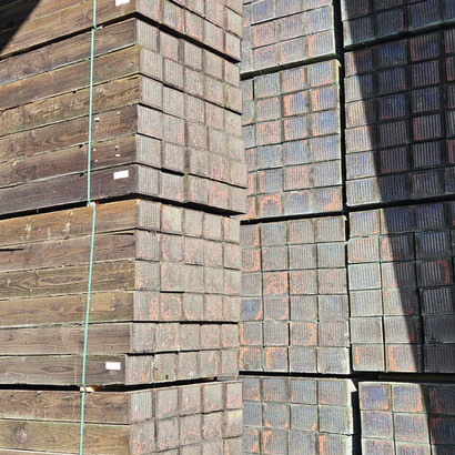 Pressure treated wooded rail ties for long-lasting structural support and durability.