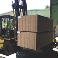 Forklift moving plywood at Conrad Forest Products facility in Rainier Oregon.