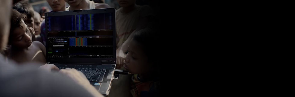 Children looking at data on a Sent Into Space team members laptop.