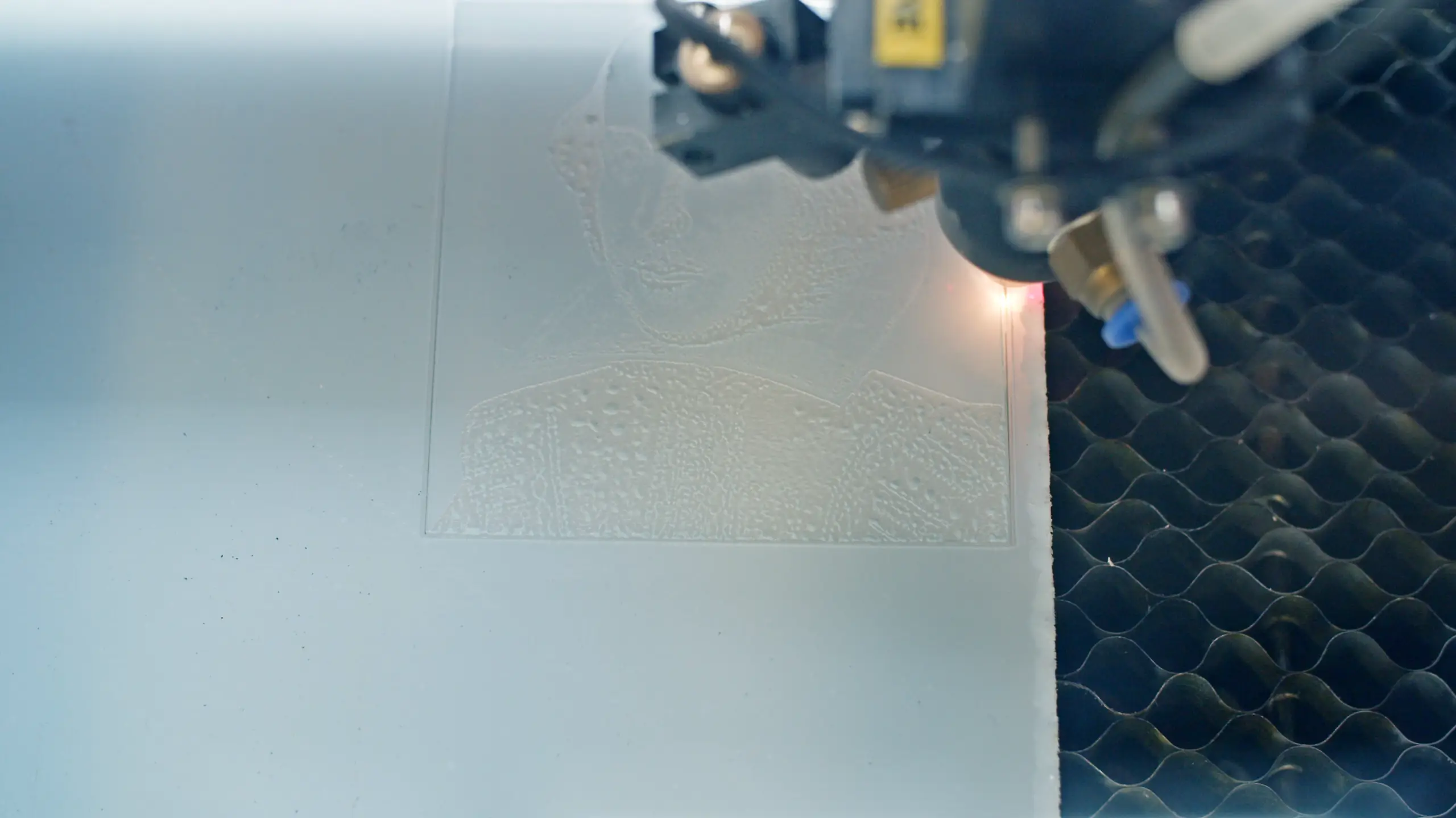 Laser cutter engraving the Folio400 Shakespeare portrait that travelled into space