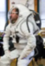 Astronaut wearing an Artemis space suit