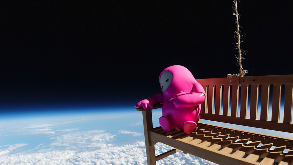 Fall Guys Bean resting on a bench in space with the Earth below