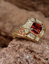 Men's 14K yellow gold signet ring featuring a square emerald-cut bezel-set garnet with diamond and garnet accents.