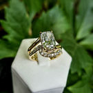Elongated cushion-cut diamond engagement ring in a bypass setting with a matching contour band featuring lab-grown diamond accents.