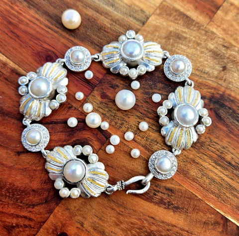 Ocean-inspired bracelet featuring pearls, diamonds, sterling silver, and 24K gold accents.