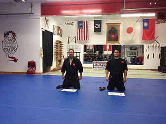 Joe Parillo and Mike Perez receiving their black belts