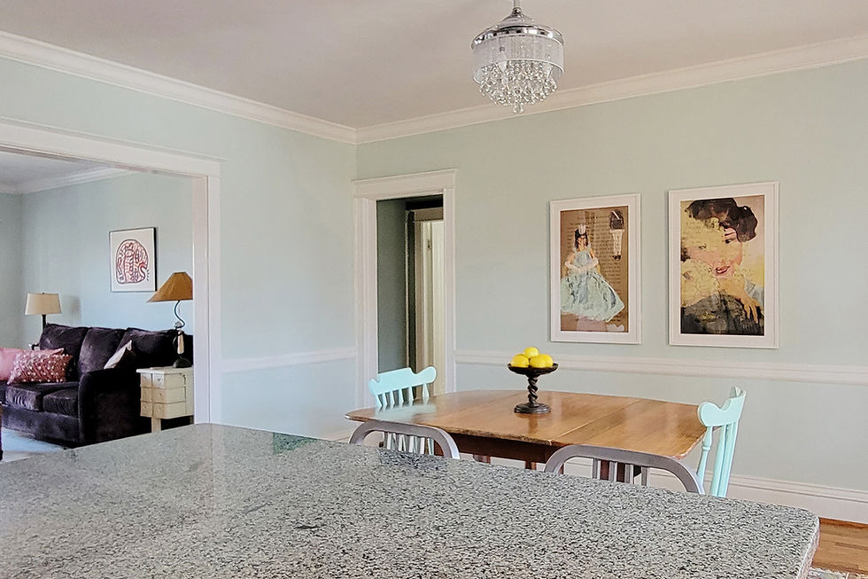 Dining room with two paintings on the wall