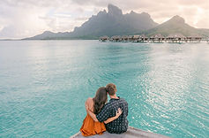 Photo source: https://www.sashapopovic.com/blog/four-seasons-bora-bora/ 15. Bora Bora, French Polynesia When I imagine myself in Bora Bora, French Polynesia, my heart nearly aches with how romantic it feels, as if the island was designed for hopeless romantics like me. I picture arriving to the sight of Mount Otemanu, rising dramatically from the centre of the island, its emerald peaks wrapped in drifting clouds like a secret meant only for those who believe in love. The lagoon below glows in impossible shades of turquoise, already promising moments I know I’ll never forget. In my daydream, I wake each morning in an overwater bungalow, the wooden deck hovering just above the crystal-clear lagoon. I imagine slipping into the water at sunrise, letting the calm surround me as the sky softens into pale pinks and golds. Somewhere in the distance, the gentle lap of the lagoon feels like a love song meant to be heard, not sung. I picture drifting across the Bora Bora Lagoon on a quiet boat, stopping near the Coral Gardens where colourful fish move like living jewels beneath the surface. Floating there feels intimate and weightless, like love when it’s pure and uncomplicated. Later, I imagine walking barefoot along Matira Beach, the sand warm and soft, the sun sinking slowly into the horizon as if it doesn’t want to leave either. As evening settles, romance deepens. I see myself sharing a candlelit dinner beneath the stars, the lagoon reflecting moonlight while Mount Otemanu stands watch in the distance. The air is warm, the world hushed, and every moment feels intentional. In Bora Bora, love feels expansive and serene; unrushed, untouched, and endlessly tender. In my hopeless romantic imagination, Bora Bora isn’t just a destination; it’s a feeling. A place where the ocean, the sky, and the heart all seem to agree that love should be this gentle, this beautiful, and this endlessly blue.