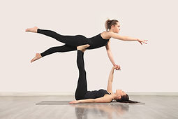 Women Practicing Acroyoga