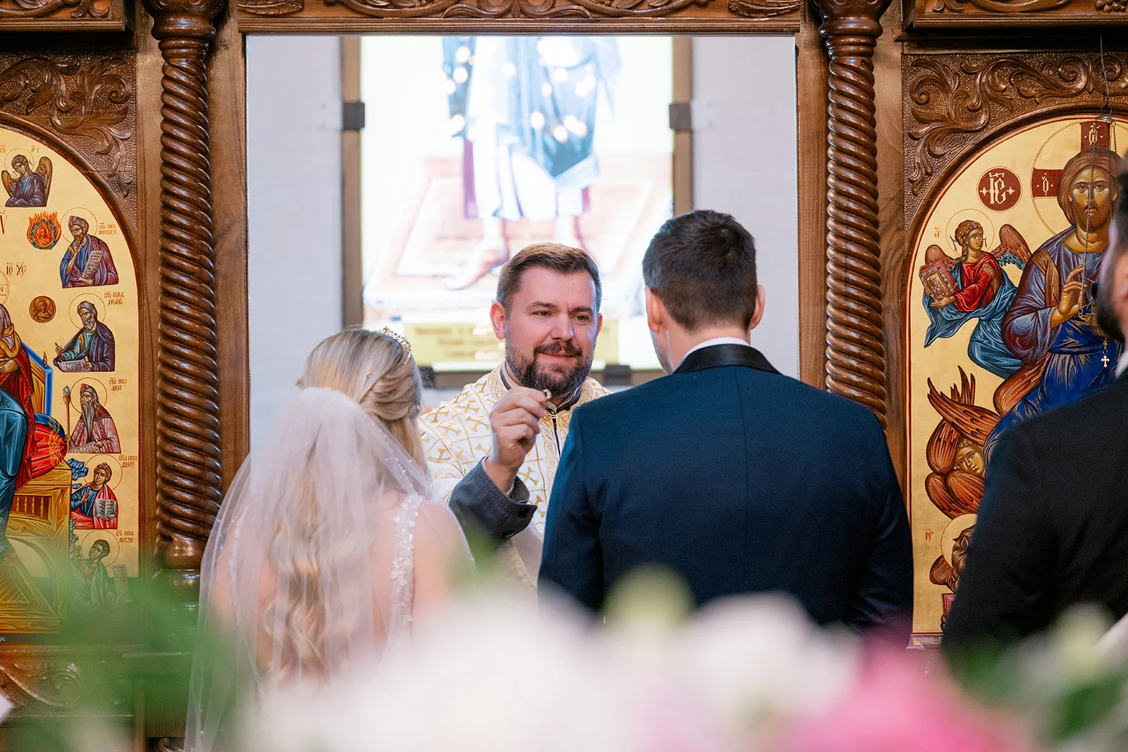 Serbian Orthodox wedding ceremony with traditional rituals including candles, crowns, and cords
