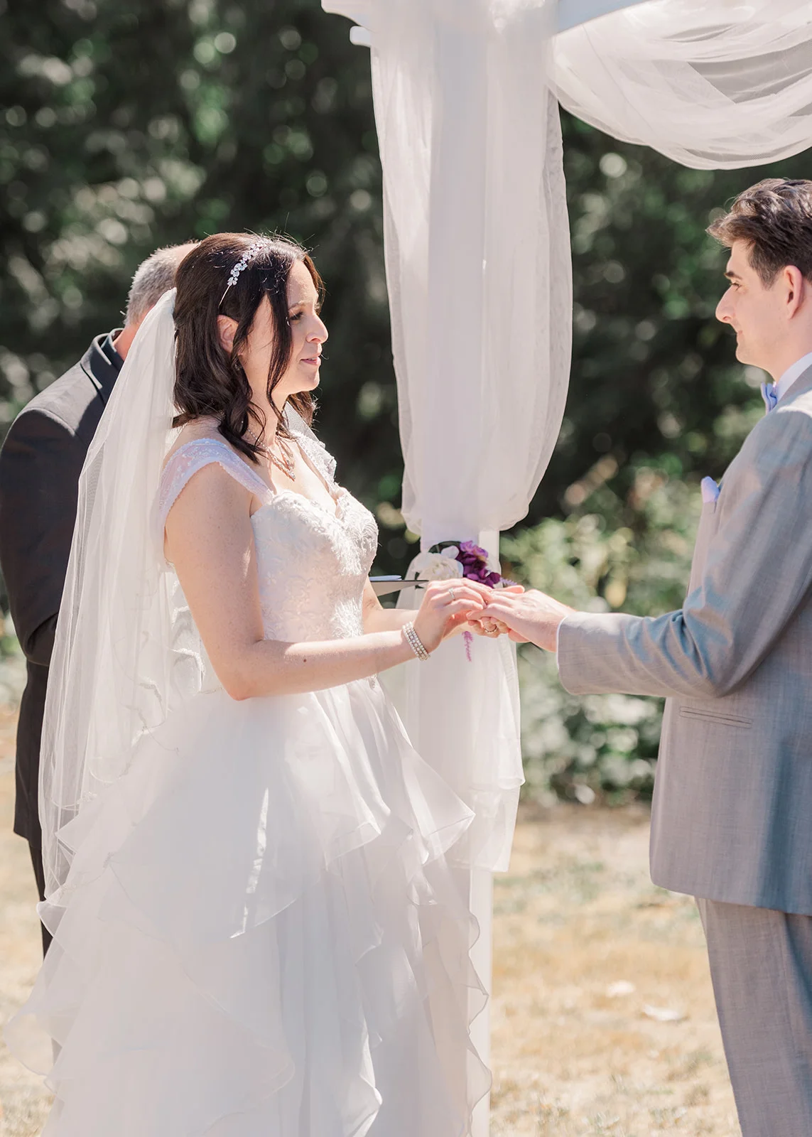 ring exchange at a summer backyard wedding in mission, british columbia