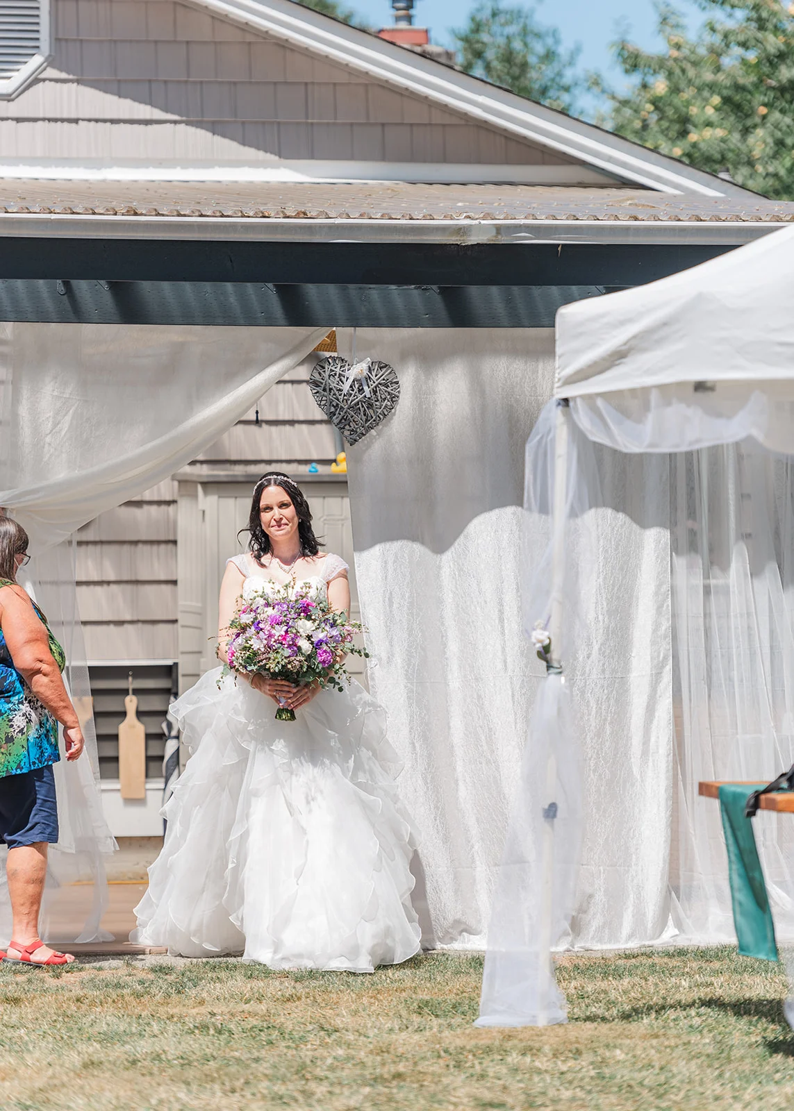 bride walking down aisle summer backyard wedding in mission, british columbia