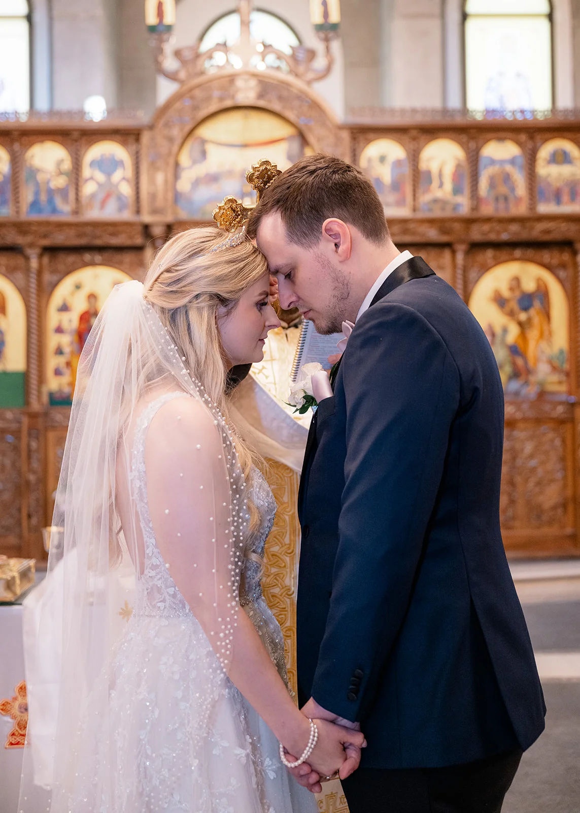 Serbian Orthodox wedding ceremony with traditional rituals including candles, crowns, and cords