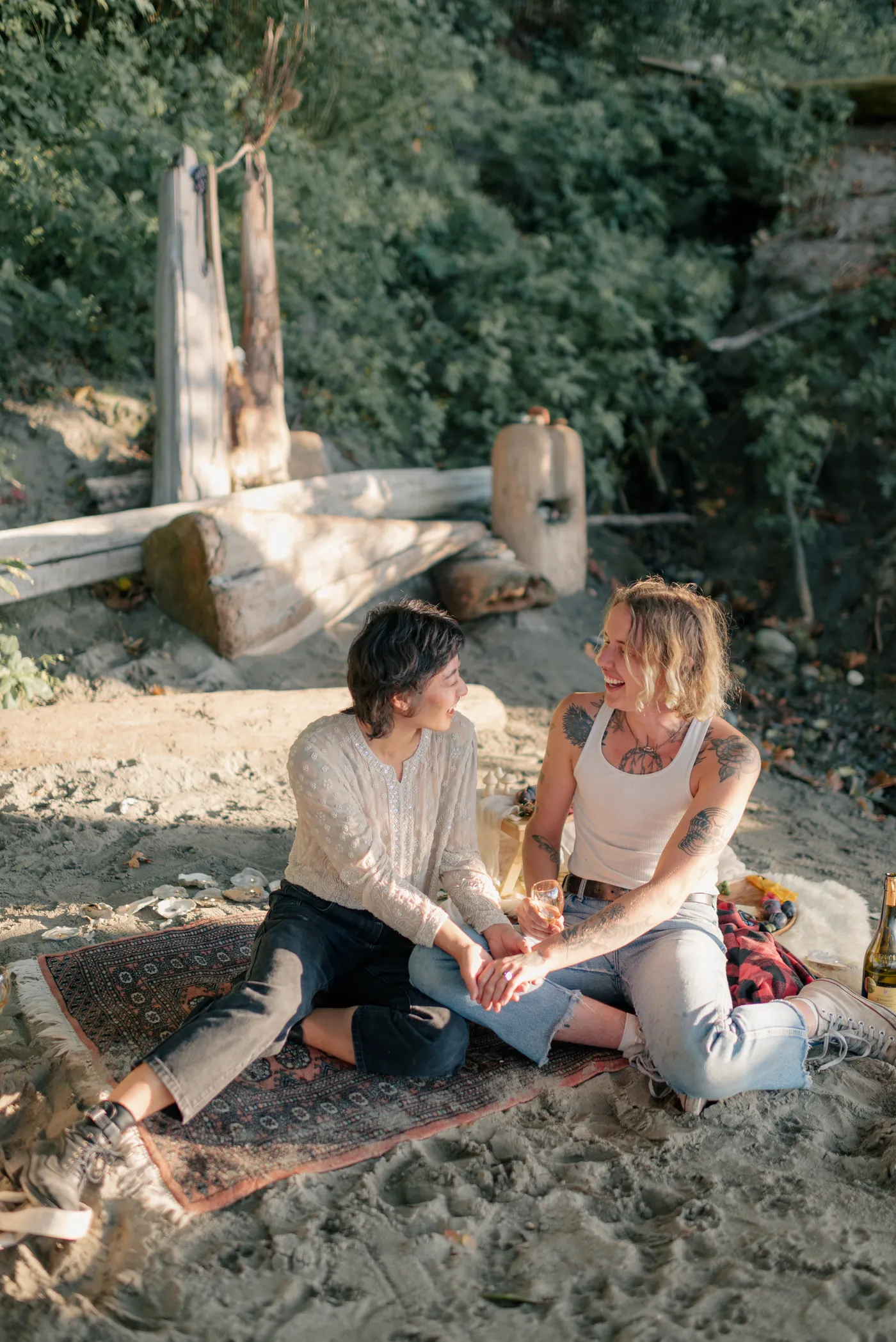 A stylish queer couple shares a quiet moment during their engagement photoshoot. Natural and intimate photography capturing LGBTQ+ love in Canada.