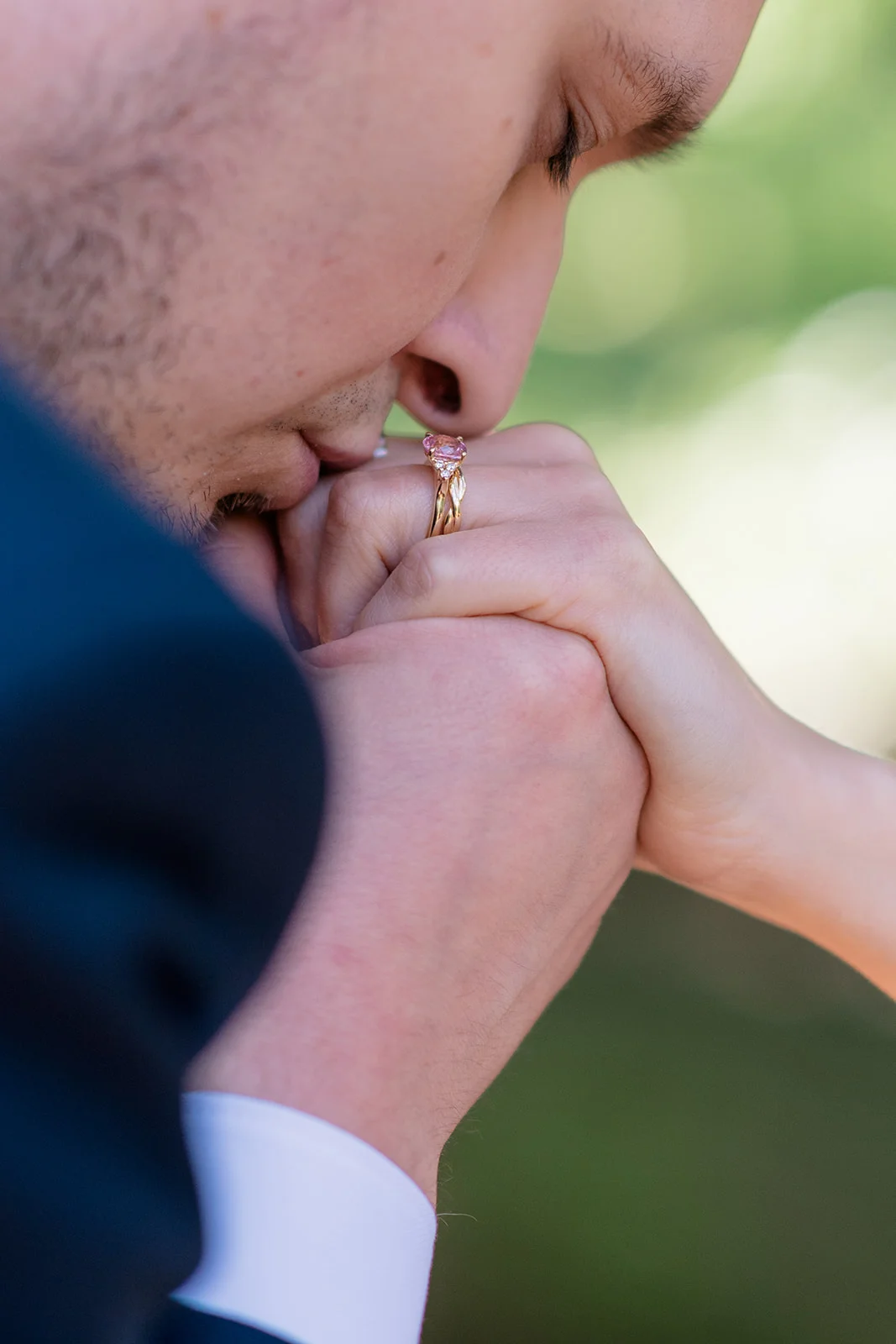 Bride and groom sharing a loving moment amidst the ethereal atmosphere of a forest, capturing the timelessness and wonder of their love story