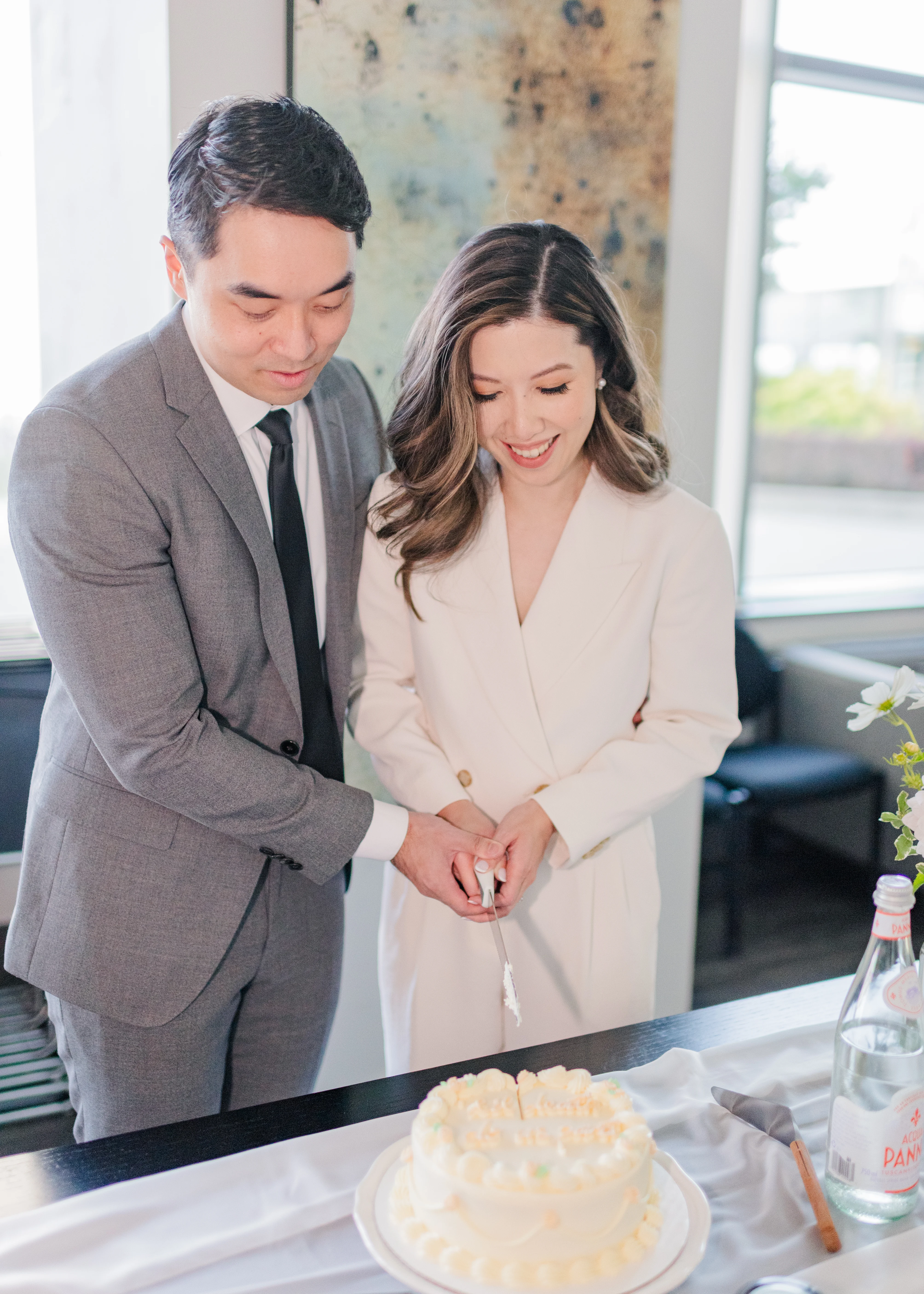 bride and groom cutting cake at civil ceremony in Vancouver, B.C. 