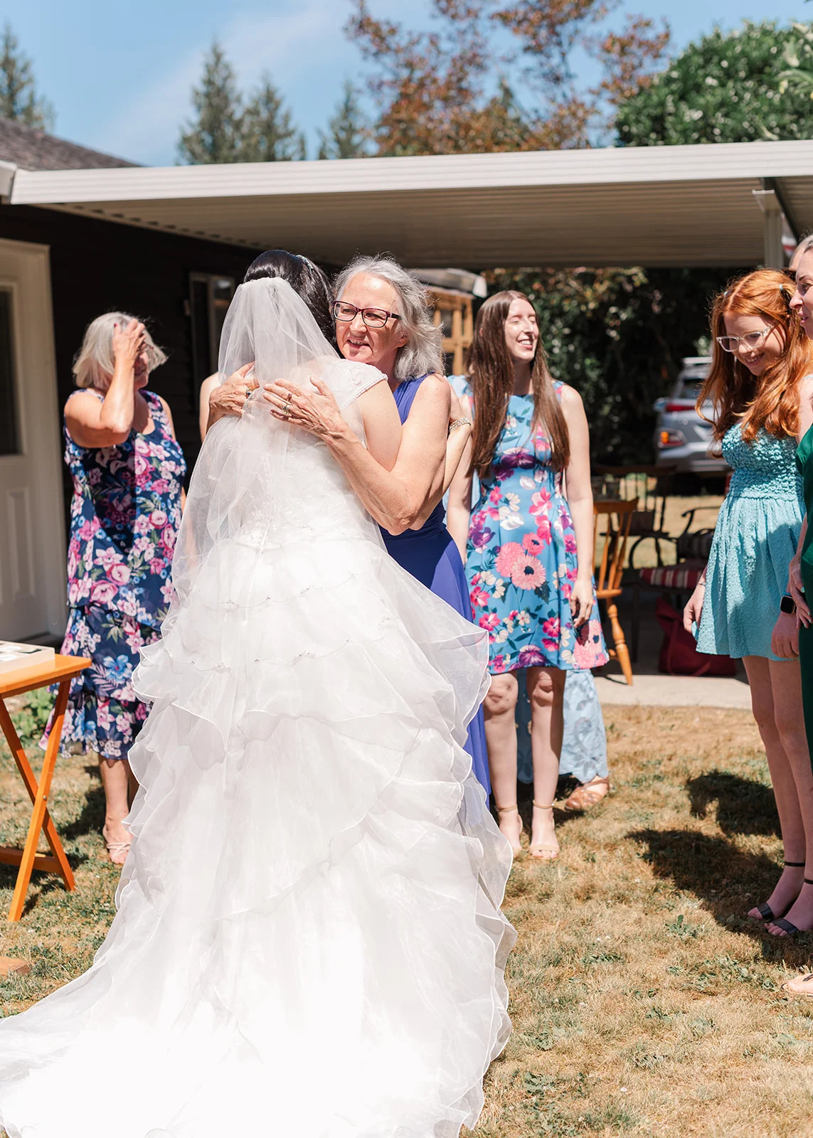 mom and daughter hugging on her wedding day in a summer wedding in misson, british columbia