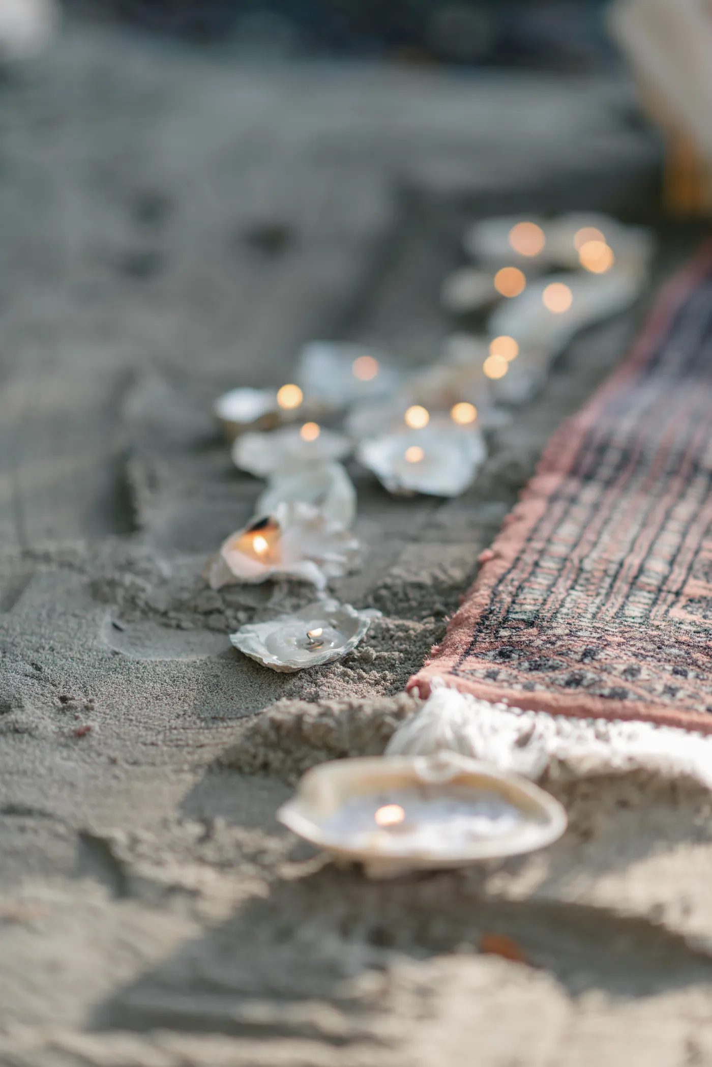 A romantic outdoor picnic proposal in Canada, set in a lush forest with a bottle of champagne and candlelit ambiance. Captured by a Canadian proposal photographer specializing in LGBTQ+ and queer couples.