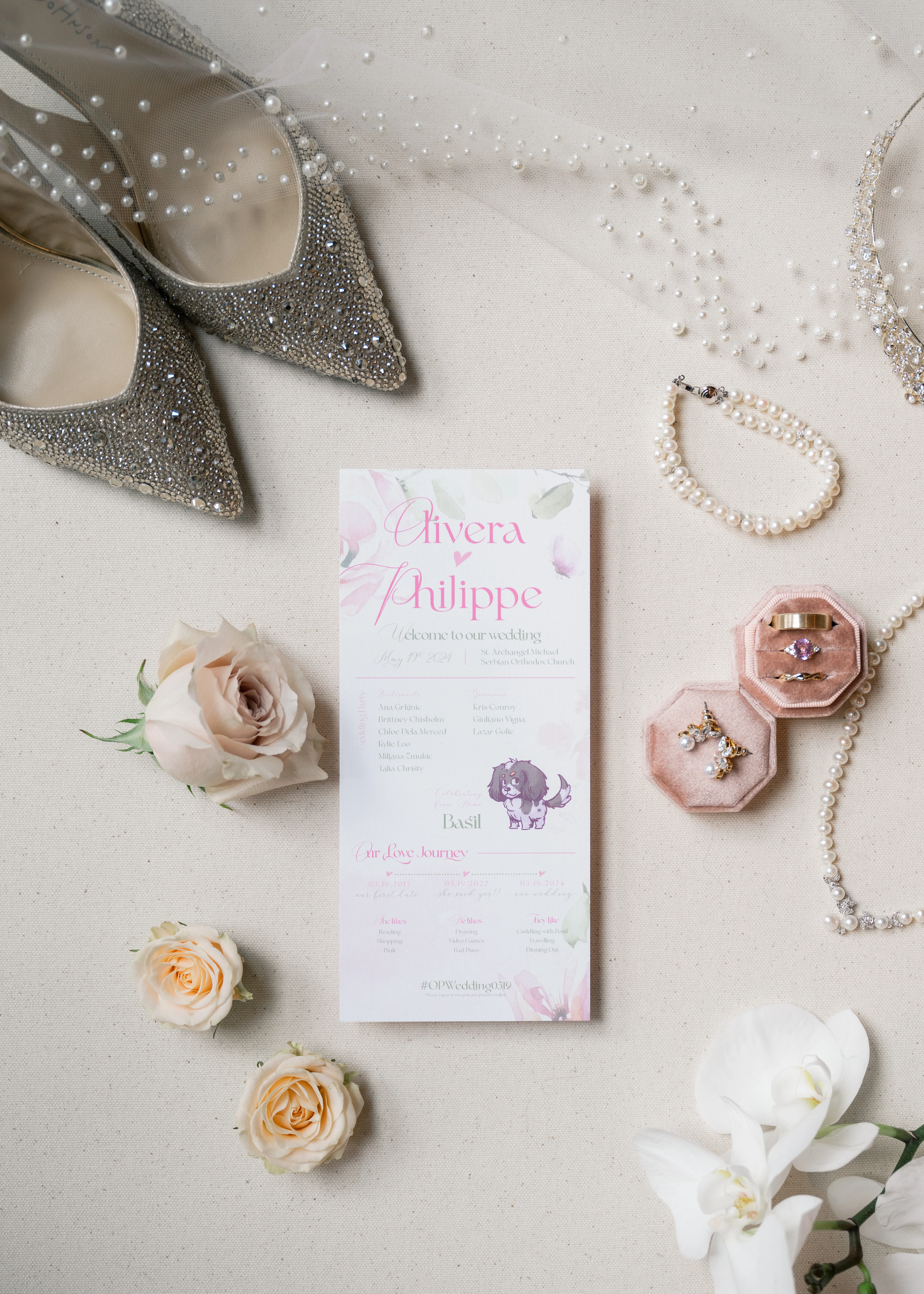 Beautiful wedding stationery featuring pink and white floral designs, including invitations, menus, and place cards.