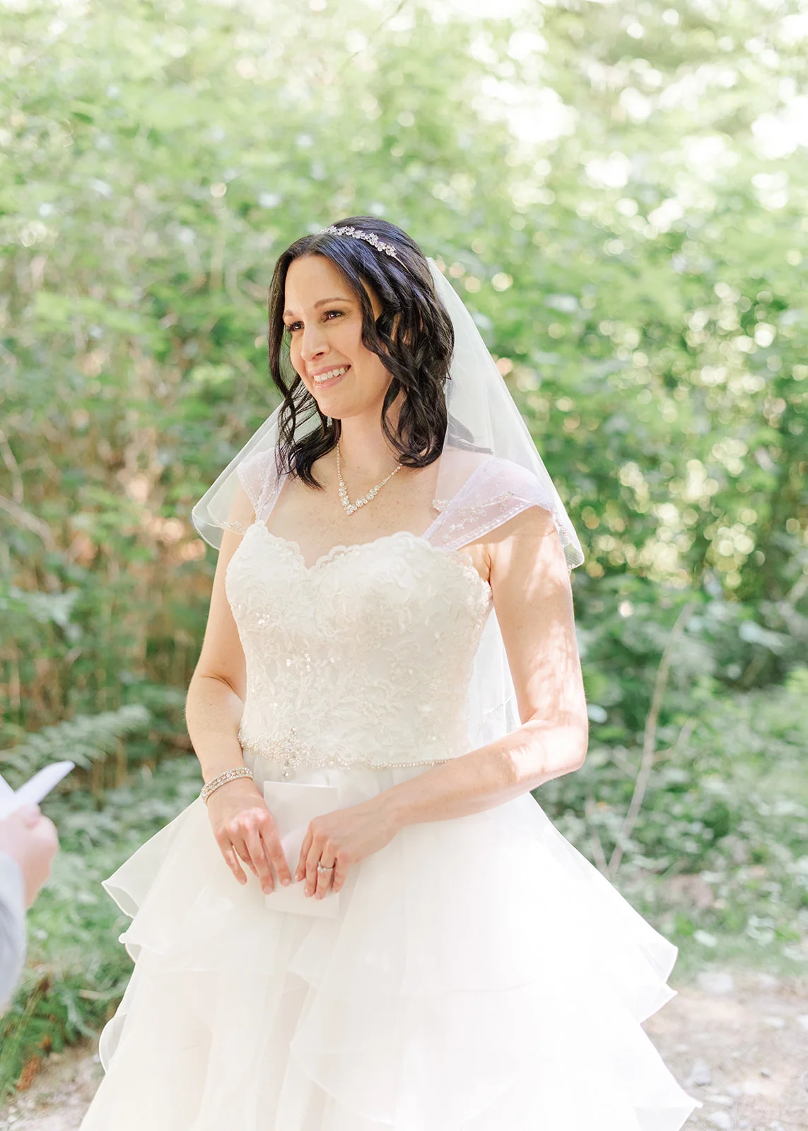 bride reading her vows to groom at a summer wedding in mission, british columbia
