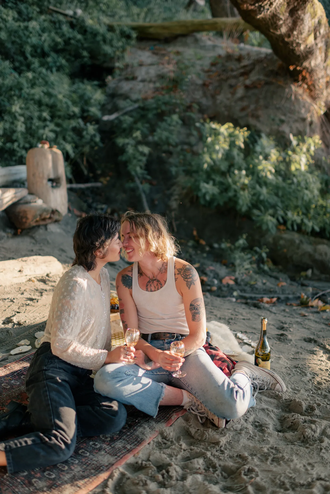 A stylish queer couple shares a quiet moment during their engagement photoshoot. Natural and intimate photography capturing LGBTQ+ love in Canada.