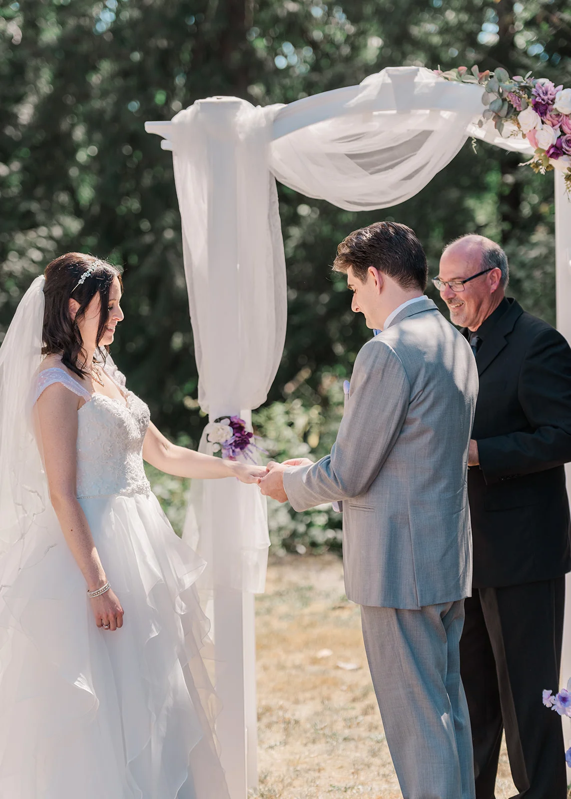 ring exchange at a summer backyard wedding in mission, british columbia