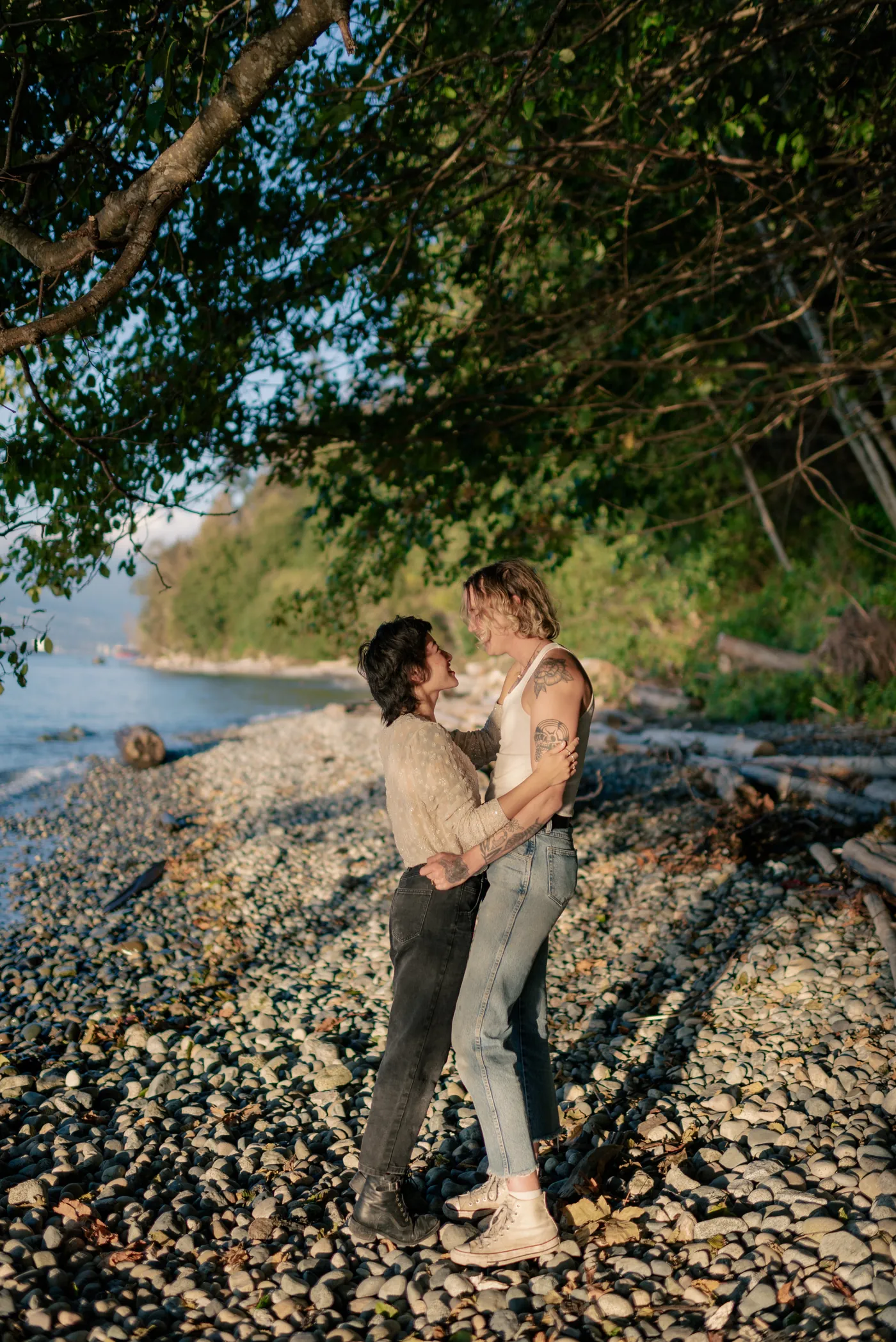 A romantic beachside engagement session with an LGBTQ+ couple and their dog. Captured at sunset, this moment showcases love and adventure in Canada.