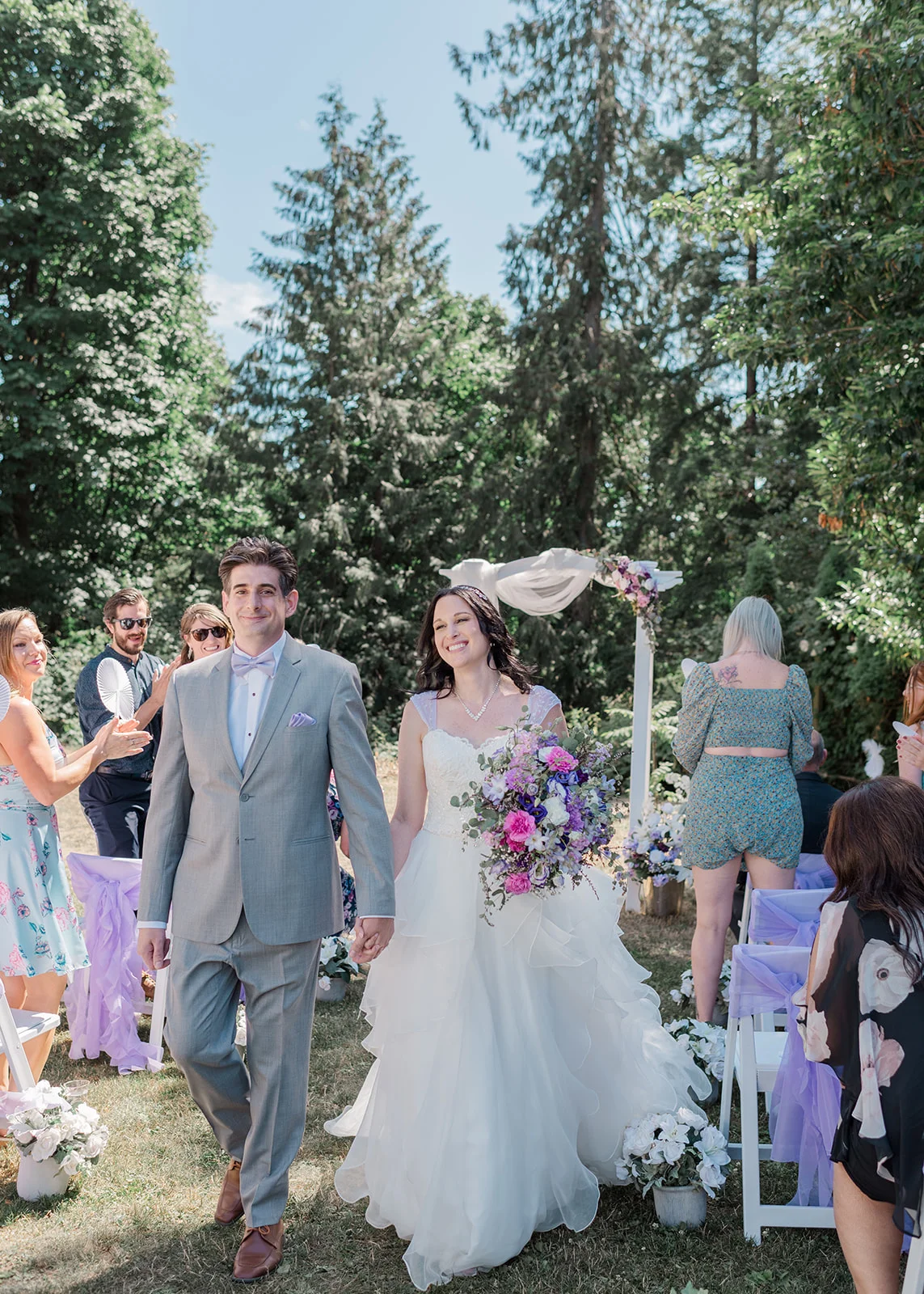 bride and groom processional summer backyard wedding in mission, british columbia