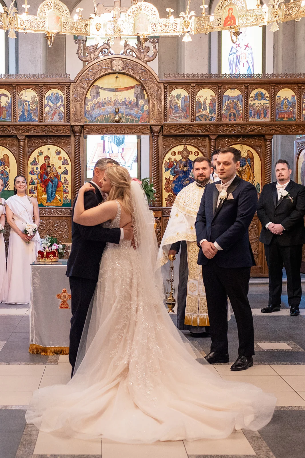 Serbian Orthodox wedding ceremony with traditional rituals including candles, crowns, and cords